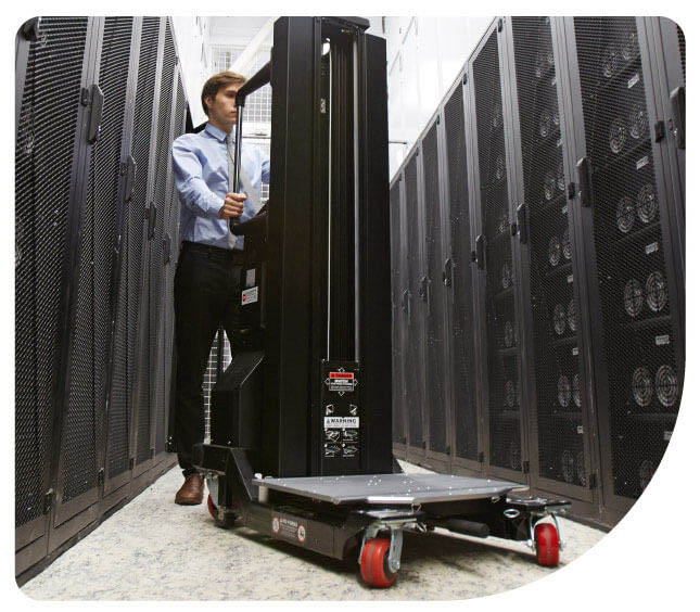 An engineer from Orion in a data centre moving servers from one rack to another as part of the smart hands break fix support.